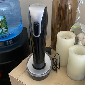 Powered wine opener with charging base